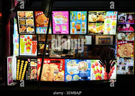 Yokohama, Japan - May 14, 2026: Unidentified man cooking in a various food stand in Yokohama, Kanagawa Stock Photo
