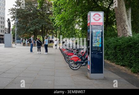 Santander rental bikes parked up on Tower Hill, London, UK Stock Photo