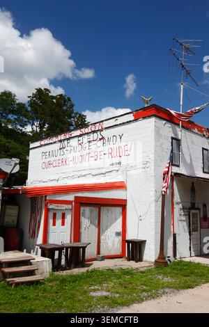 "Coming Soon" and "Our Clerks Won't Be Rude" writing on white painted wall of Mr Fred's store / house near Gettysburg, Pennsylvania, USA Stock Photo
