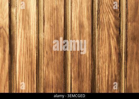 Natural wooden plank texture with vertical boards. Rustic wood background suitable for interior design construction and graphic projects. Stock Photo