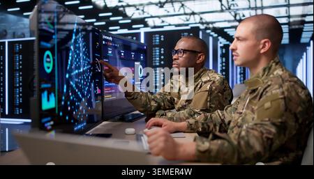 Two Data Scientists Study Deep Learning Models On Advanced AI Software. Stock Photo