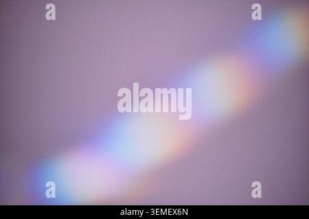Light refracting into colorful spectrum forming abstract background with soft focus gradient Stock Photo