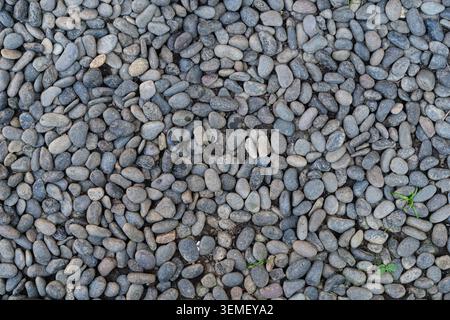 Small pebbles beach or river stones. Seamless texture background. Graphic resource material Stock Photo