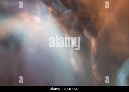 Abstract blurred background with warm and cool light leaks Stock Photo