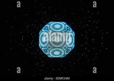 Glowing blue futuristic geometric sphere in dark space Stock Photo