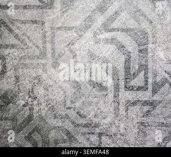 Distressed Ancient Geometric Pattern on Light Gray Background Texture Stock Photo