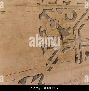 Close Up of Vintage Patterned Ceramic Tile with Distressed Arabesque Motif Stock Photo