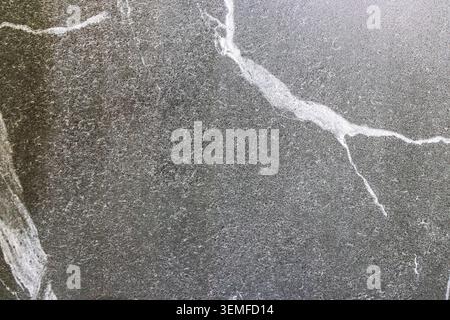 Charcoal Granite Stone Surface with Detailed Mineral Quartz Lines Stock Photo