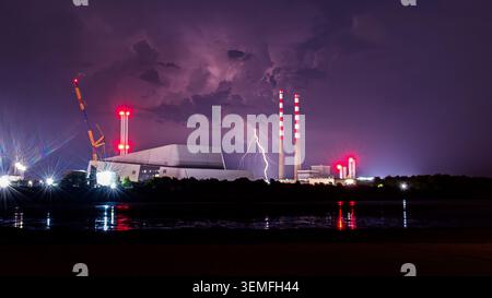 Lightning strike beside Poolbeg from Sandymount due to a thunderstorm near Wales Stock Photo