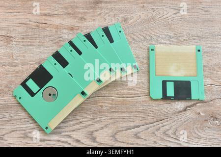 floppy disk old technology for saving data arranging on table Stock Photo