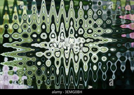 Abstract dark green white fluid kaleidoscope texture from green hydrangea flower and leaves with vertical oval pattern background for wallpaper Stock Photo