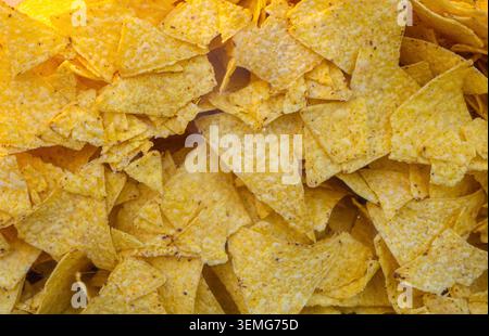crunchy yellow corn tortilla chips, a popular snack often used for dipping Stock Photo