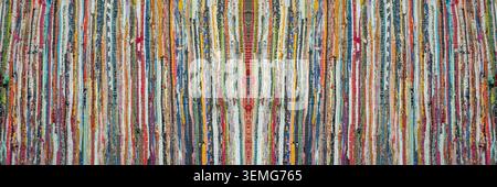 vibrant multicolored rag rug, handwoven from cotton fabric scraps Stock Photo