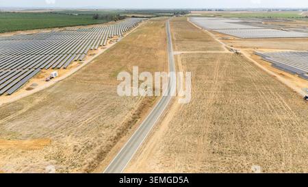 Expansive solar farm under construction in Coria del Rio, Spain. Rows of panels capturing sun for clean energy Stock Photo