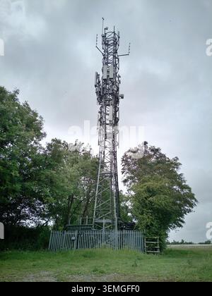 Telecommunication tower with 5G cellular network antenna in rural location Stock Photo