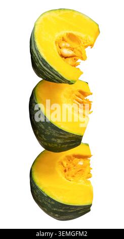 Green Japanese pumpkin fruit cut into three pieces or quarters or slices in stack is isolated on white background with clipping path. Stock Photo