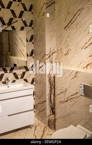 Modern Grey Bathroom Interior with Floating Vanity and Patterned Tiles Stock Photo