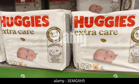 Two packs of baby diapers on a store shelf Stock Photo