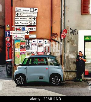 A Citroën Ami: A tiny, two-door electric quadricycle tailored for tight city driving. It tops out at 28 mph with a 43-mile range. Stock Photo