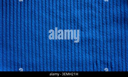 Dark blue ribbed corduroy fabric texture background with vertical lines pattern for fashion design Stock Photo