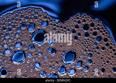 Close up of oil and water mixture creating bubbles texture Stock Photo
