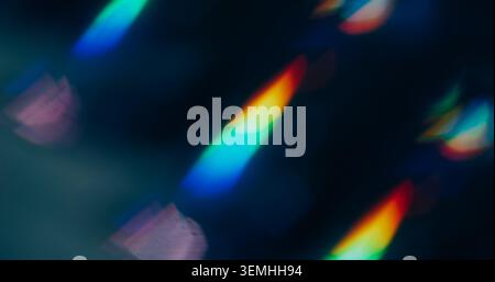 Glow radiance. Blur flecks spark. Defocused yellow blue red multicolor lens flare flicker beam gleam on abstract art dark black background. Stock Photo