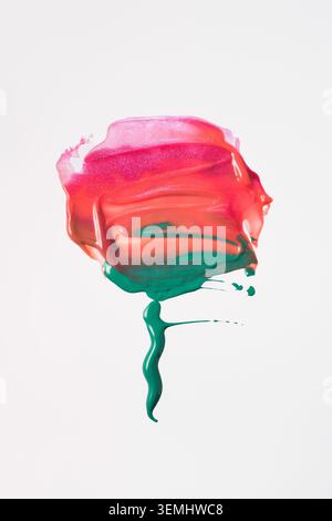 Abstract flower shape made from lip gloss and shadow against white background Stock Photo