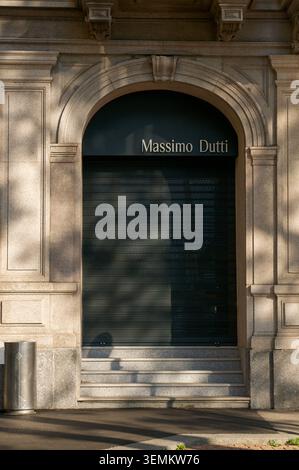 Lugano, Ticino, Switzerland - 24th May 2026: Close up of the Massimo Dutti corporate logo on an elegant stone facade with the shop's dark metal securi Stock Photo