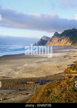 Beach at Roads End Point with Pacific Ocean on Oregon Coast in evening light Stock Photo