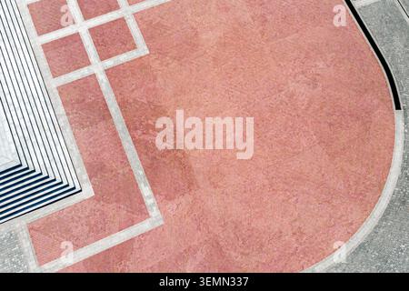 urban square paved with red and gray tiled stone. aerial top view. Stock Photo
