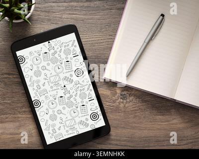 Tablet showing various e-learning and education related doodles, next to an open notebook and pen on a wooden desk Stock Photo
