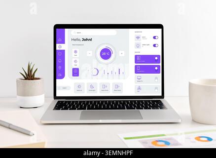 Laptop showing a user interface for controlling smart home devices and adjusting room temperature, highlighting modern technology and convenience Stock Photo