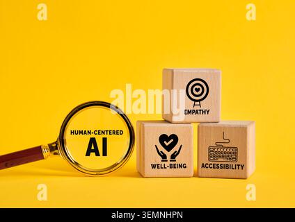 Human centered AI concept featuring a magnifying glass highlighting AI principles of empathy, well being, and accessibility on wooden blocks Stock Photo