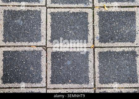 Stone pavement texture. Granite cobblestoned pavement background. Abstract background of a cobblestone pavement Stock Photo