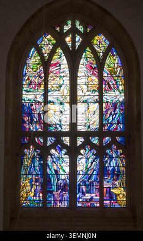 Stained glass west window by artist Andrew Johnson in the church of Lady St. Mary in Wareham, Dorset Stock Photo