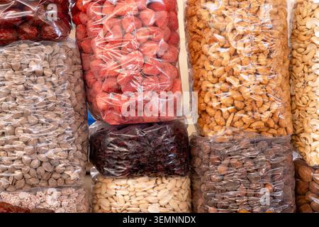 Alay Bazaar, Tashkent, Uzbekistan, Central Asia. The bazaar sells dried fruits, nuts, herbs, and tea bags. Concept: an abundance of organic produce Stock Photo
