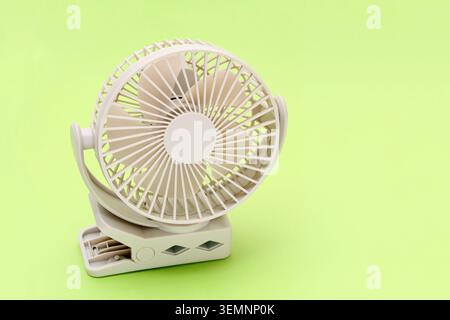 rechargeable portable small fan on a table background Stock Photo