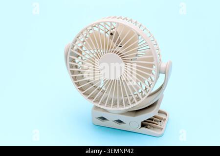 rechargeable portable small fan on a table background Stock Photo