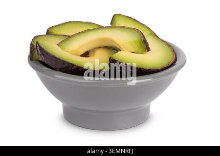 avocado slices in ceramic bowl isolated on white background close up Stock Photo