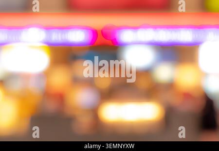 Abstract colorful bokeh background with blurred neon lights and glowing urban illumination, vibrant defocused nightlife scene featuring soft luminous Stock Photo