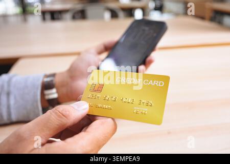 Credit card used for secure online shopping payment and mobile Stock Photo