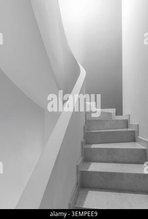 Minimalist staircase with curved architectural lines in monochrome Stock Photo