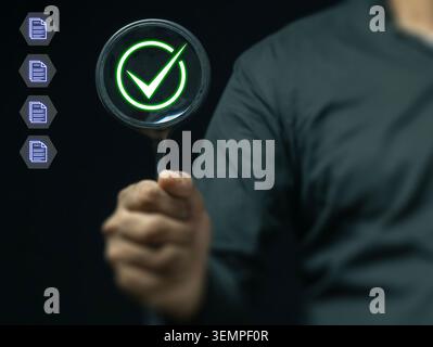 Document Verification and Quality Assurance Inspection Concept with Approval Checkmark. Stock Photo