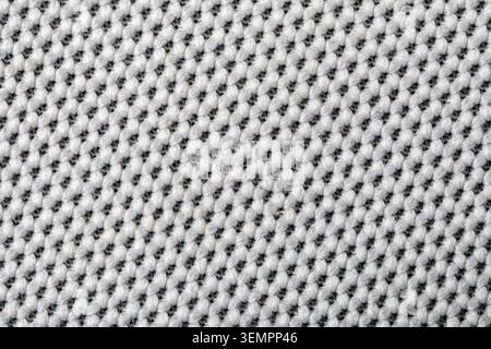 White knitted fabric displaying a detailed woven material texture Stock Photo