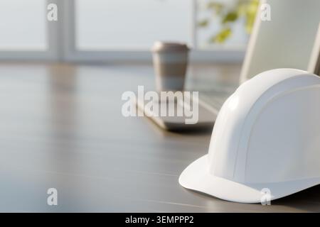 3D render of a white safety helmet on a wooden table with a blurred laptop and paper coffee cup in the background. Concept of construction safety, arc Stock Photo
