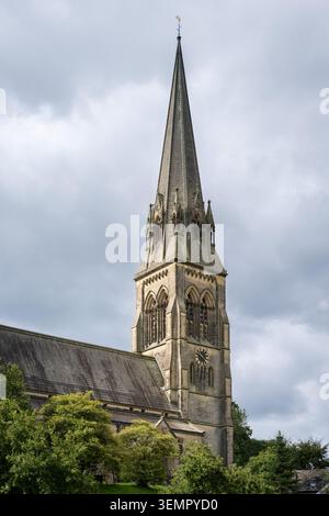 A dramatic, vertical low-angle view emphasizing the soaring Gothic Revival steeple Stock Photo