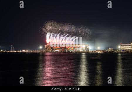 Ras Abu Aboud, Doha, Qatar - January 22, 2026: Night view of Stadium 974 and Rixos Gulf Hotel in Doha, Qatar, during a vibrant fireworks. Stock Photo