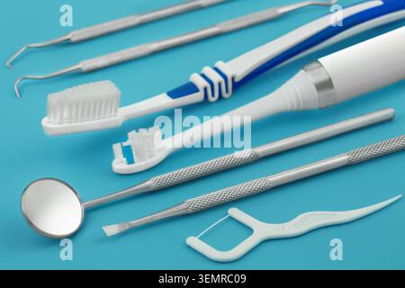 Dental care tools and products on blue background Stock Photo