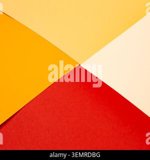 sheets of colored paper. Many colored sheets of paper are laid out in the harsh composition. background of colored paper. warm colors Stock Photo
