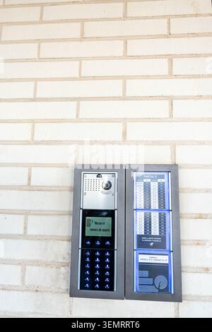 Modern intercom system with digital directory and keypad for apartment building entry security Stock Photo